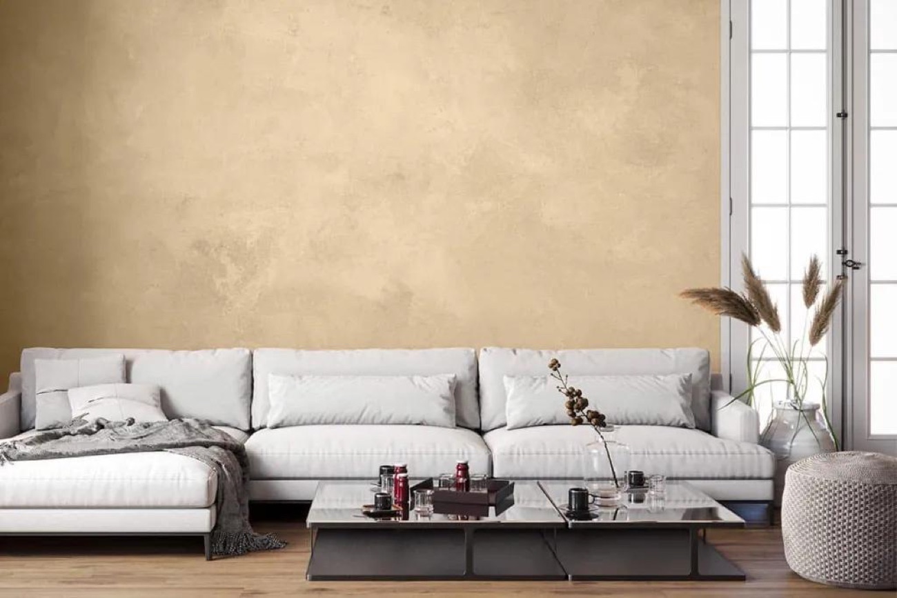 Lime-plaster lounge wall in a soft clay tone