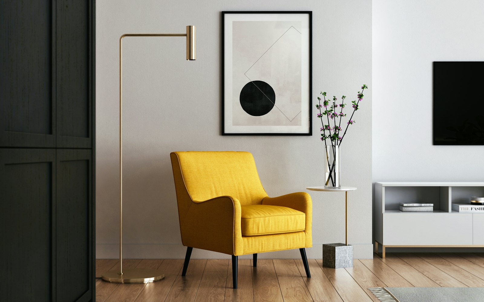 Living room with mustard armchair, brass lamp and gallery wall