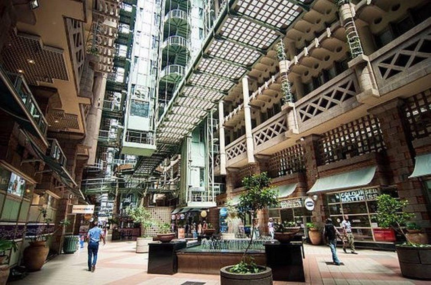 Inside the Eastgate Centre: a tall glazed atrium that carries warm air up and out of the building