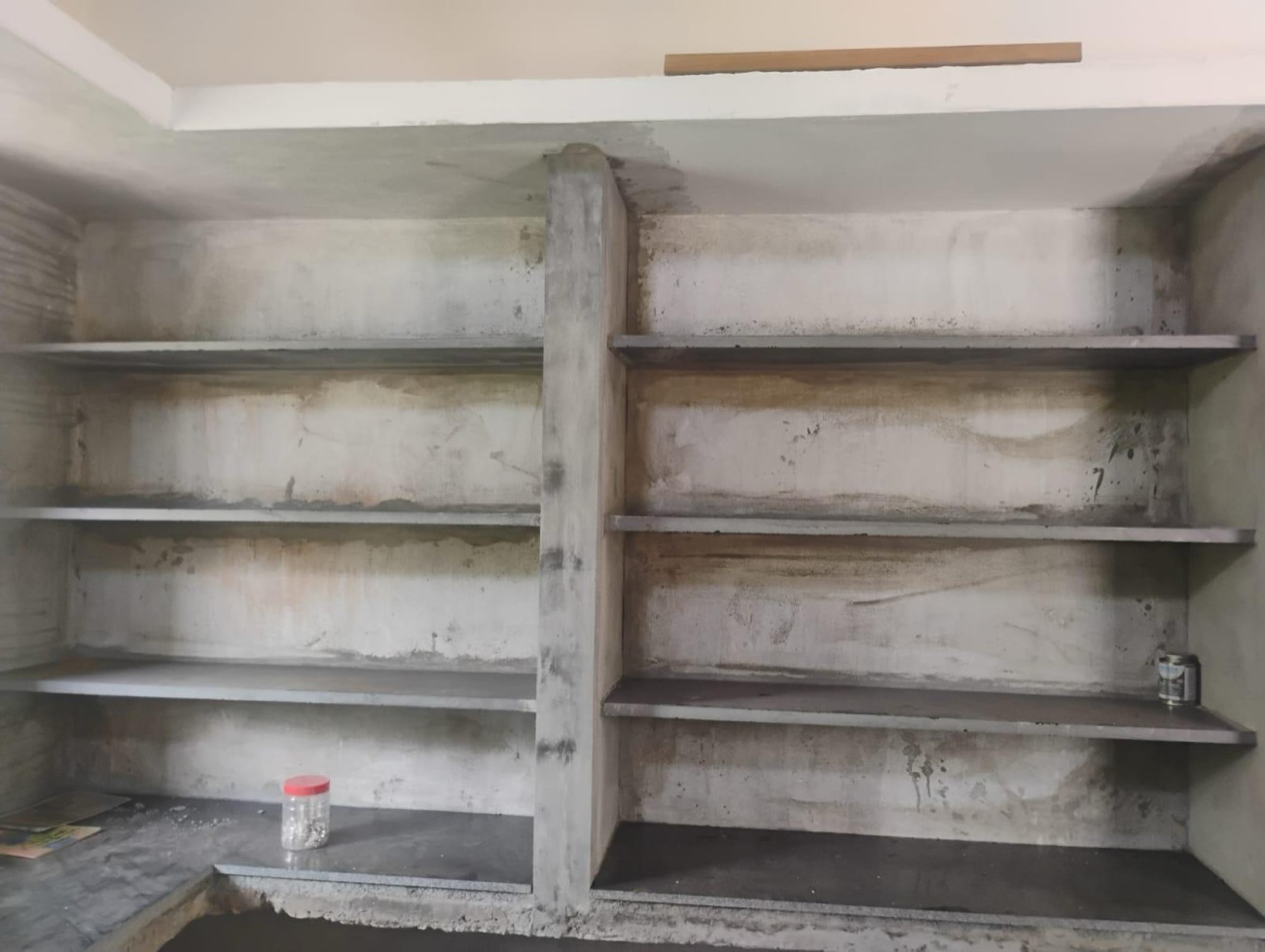 Concrete shelving cast in place before finishing